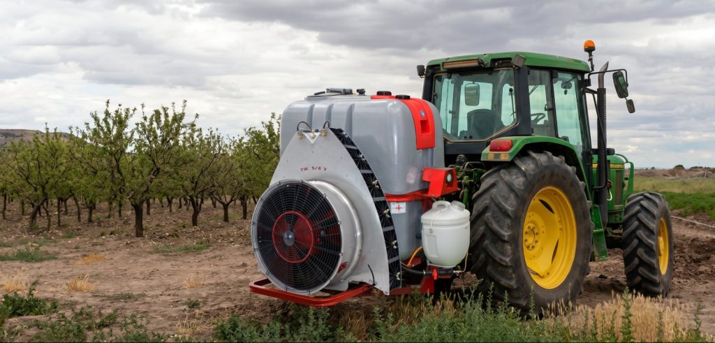 Tractor with a Twister S6 mounted sprayer next to an olive grove